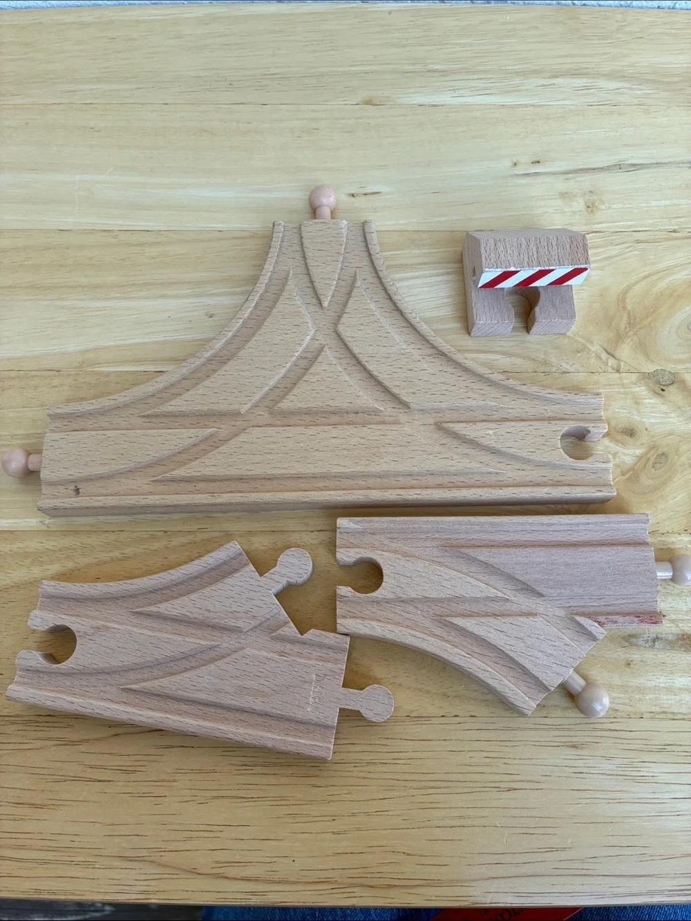 Wooden train tracks and light  Lot of 12 pieces. Great addition to your set!
